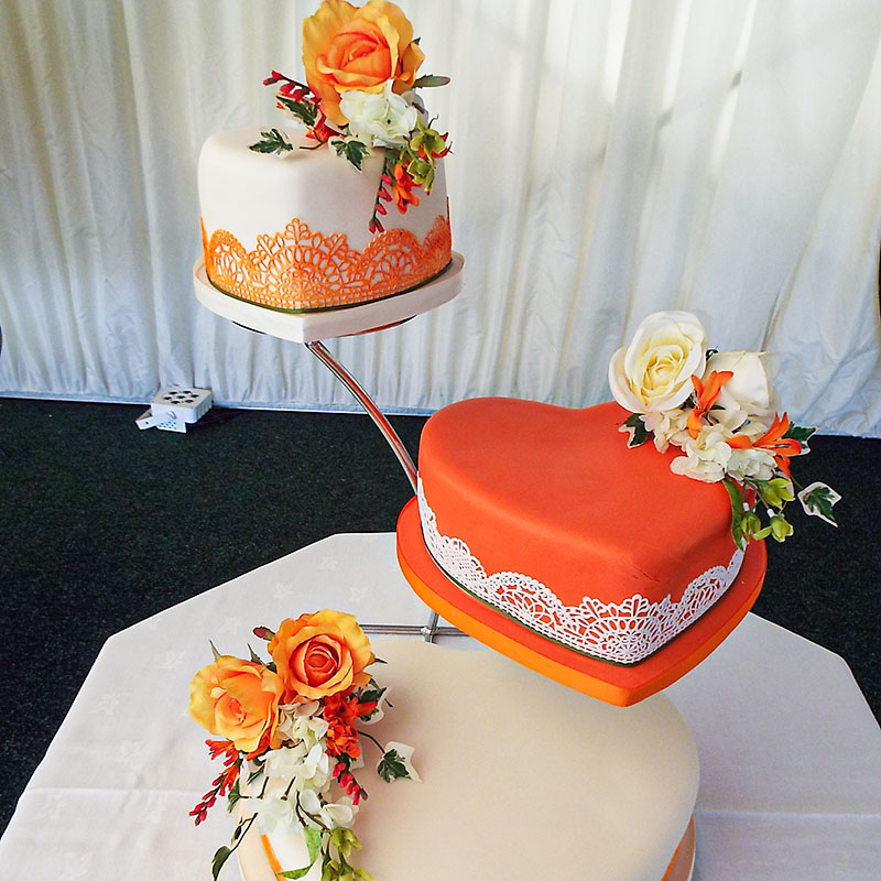 ivory orange lace flower heart wedding cake