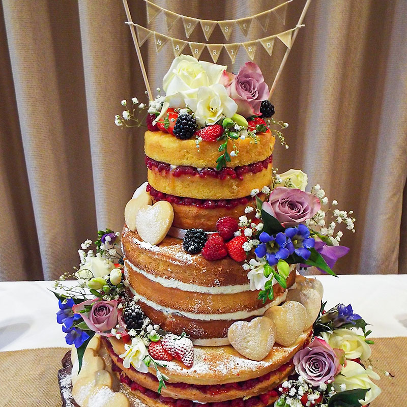 naked wedding cake flowers fruit shortbread hearts